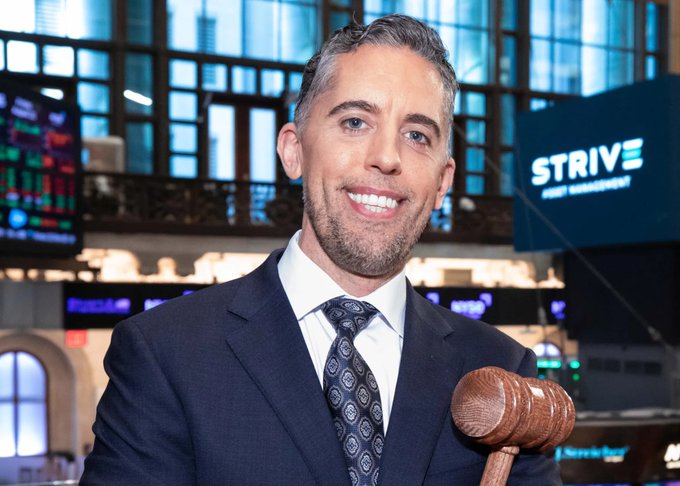 urn of gold and blue liquid, a large screen displaying stock market data, and a man in a suit holding a gavel against a blurred cityscape backdrop.