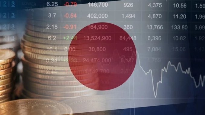 The image shows stacks of coins overlaid with the Japanese flag and financial market data, including figures like 6.25, 146,700, 926, and 4,375, alongside a downward-trending line graph. This visual ties to Japan's financial sector, complementing news of the country's move to launch a blockchain-based system for instant settlement of stocks and government bonds, signaling a modernization of its traditional financial infrastructure.