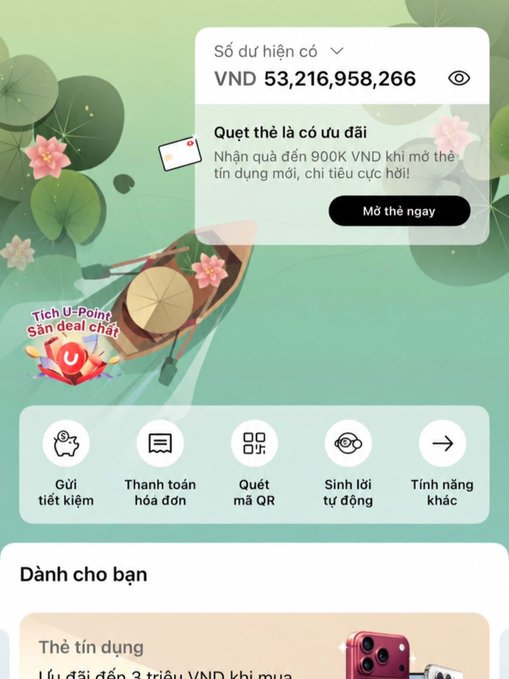 A Vietnamese mobile banking app screen showing a balance of "VNĐ 53,216,958,266", a credit card offer to receive 900K VND for opening a new card, and navigation icons for savings, payments, QR scanning, and face ID.