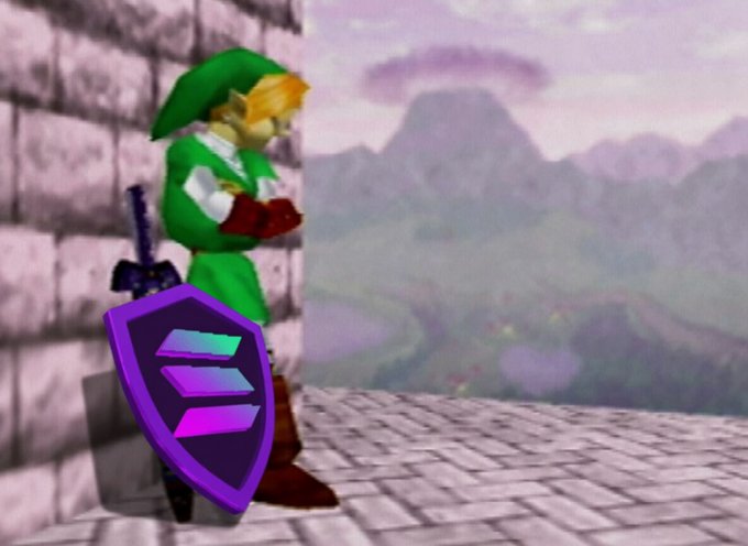 A screenshot from a video game shows Link from The Legend of Zelda standing on a stone platform with his sword and shield, set against a mountainous landscape. The character is overlaid with the Solana ($SOL) logo on his shield, visually representing the post's message "I Link Solana $SOL" by merging the iconic gaming hero with the cryptocurrency brand.