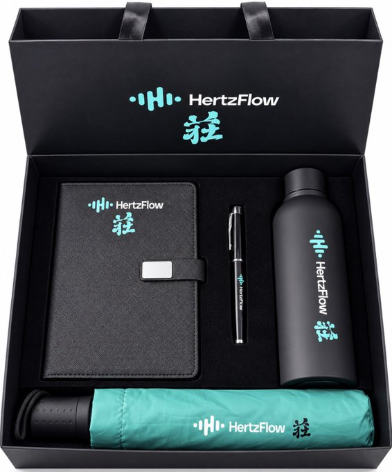 A black gift box branded with 'HertzFlow' and Chinese characters, containing a notebook, a black pen, a black water bottle, and a folded teal umbrella, all featuring matching branding.