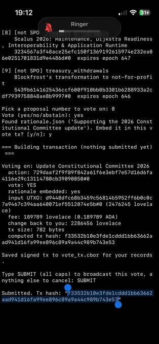 A screenshot of a mobile terminal showing the Ringer voting tool displaying a "Submit" prompt, with the user typing "SUBMIT" to broadcast their YES vote for the 2026 Constitutional Committee update. The transaction details show voting "YES" with rationale embedded referencing "Supporting the 2026 Constitutional Committee update," confirming the vote submission mentioned in the post.
