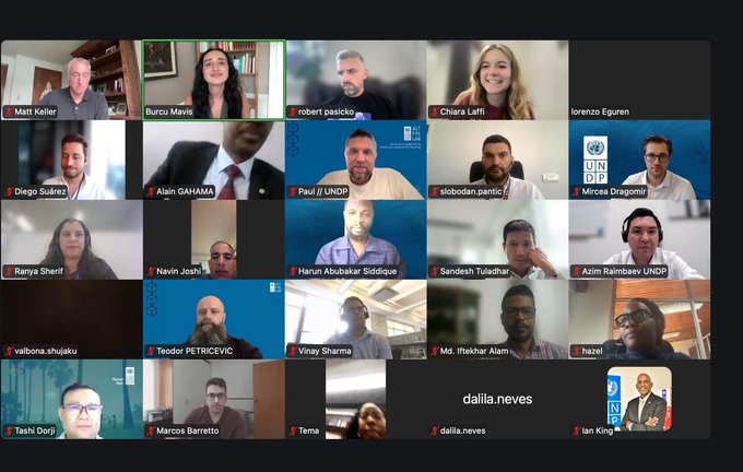 The image shows a group of people participating in an online meeting or webinar with their faces displayed on a computer screen. The participants are arranged in rows, suggesting that they might be attending a virtual event or conference. The text "The second @UNDP Blockchain Academy cohort delivered in partnership with Alorand graduated last week" indicates the context of the image and highlights the significance of this particular event.