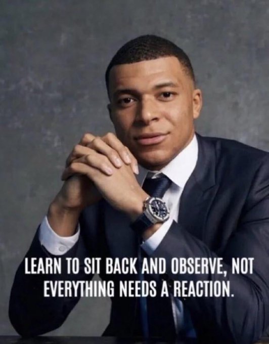 A man in a dark suit and tie sits with his hands clasped, with the caption "LEARN TO SIT BACK AND OBSERVE, NOT EVERYTHING NEEDS A REACTION." The image reinforces the post's message by advising patience and restraint in response to tribalism, suggesting it's wiser to observe and reserve judgment rather than react to early community drama.