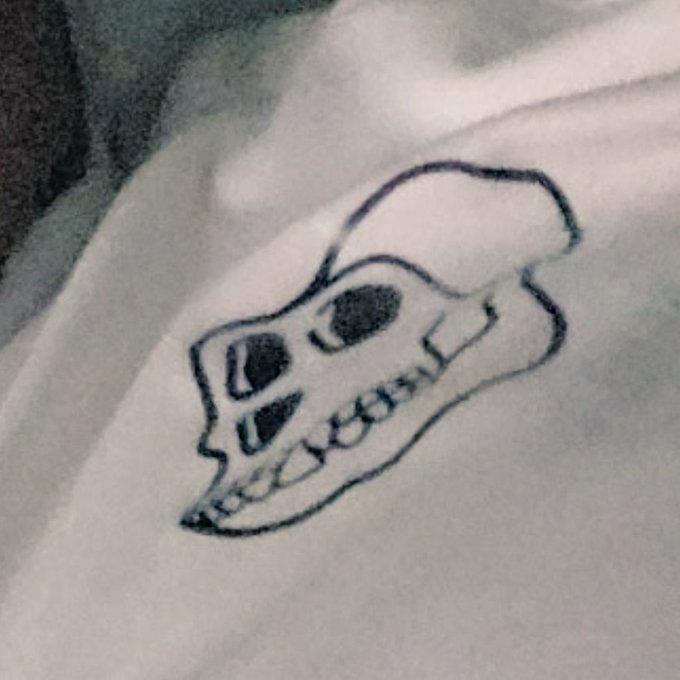 The image features a black and white drawing of a skull, which appears to be drawn with ink or pencil. The drawing is placed against a white background, making it stand out prominently. The text "BoReD ApE YaChT ClUb" is also present in the image, likely indicating that this artwork was created by someone named BoReD.