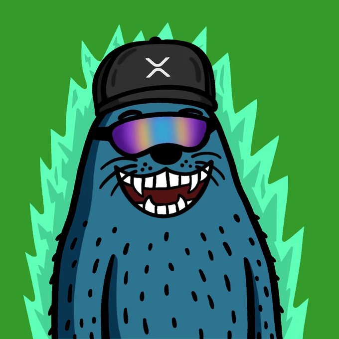 The image features a cartoon seal wearing sunglasses, a hat with an "X", and glasses that are tinted blue. The seal appears to be smiling and has a big, friendly expression. The background of the image is green, which complements the overall color scheme of the seal's outfit. There is no text present in the image, but it seems to be related to the post about celebrating real NFT communities on the XRPL this week.