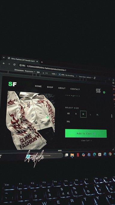 Laptop screen displaying the Slime Fashion | SF Hoodie Web3 product page with size selection and 'Add to Cart' button.