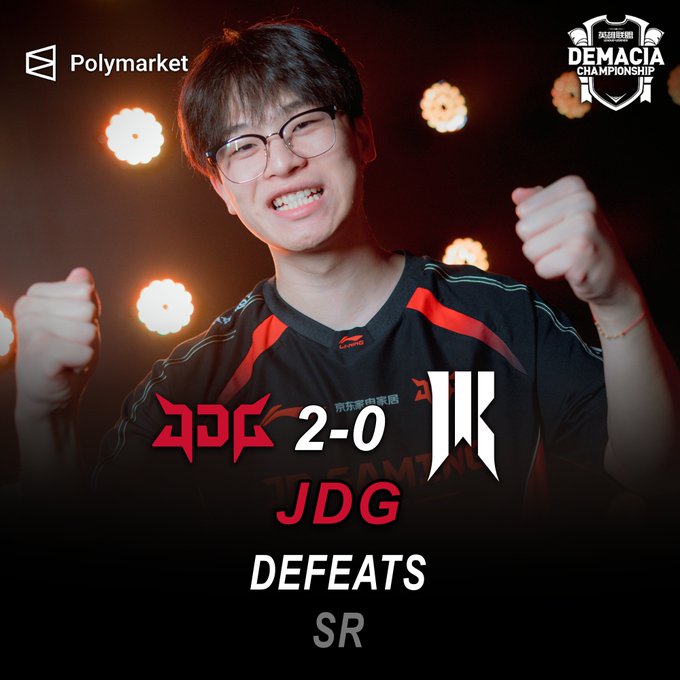 A young man in glasses cheers with both fists raised, celebrating JDG's 2-0 victory over SR, with Polymarket and the Demacia Championship logos visible.