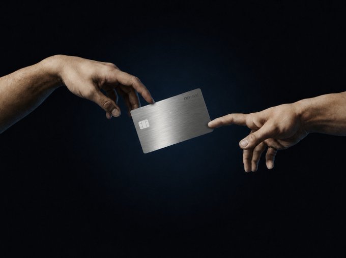 Two hands reach toward each other across a dark background, one passing a metal credit card stamped with the "moss" logo to the other — a visual metaphor for transferring value after a neobank collapse. The card being handed off symbolizes the recovery and re-homing of funds lost when platforms like Cypher shut down.