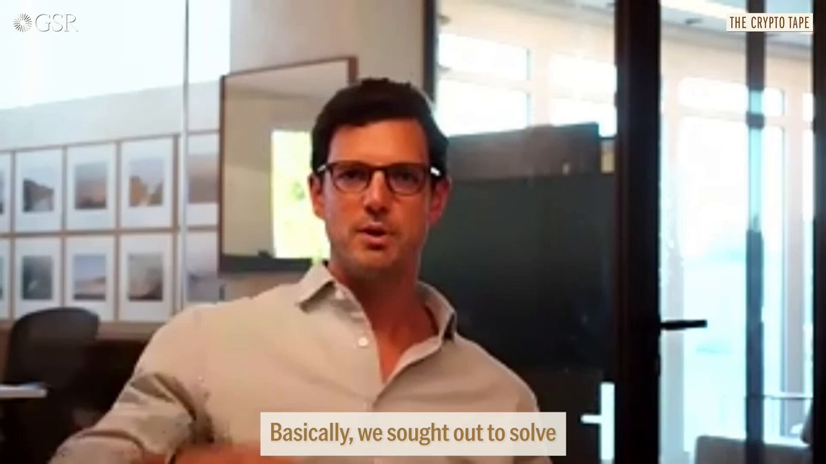 The image shows a man wearing glasses sitting at a desk, with a window behind him. The background of the image features several framed pictures hanging on the wall above the man's head. The text in the image reads "Basically, we sought out to solve" and "blockchain Data Problems", which suggests that the man is discussing or explaining blockchain data problems related to the basics of using blockchains for data storage and management.