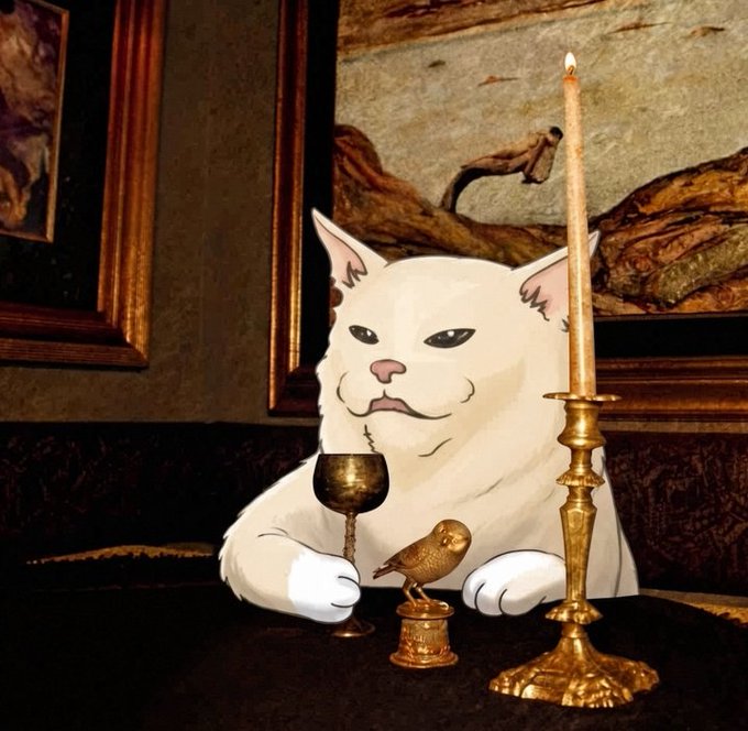 A stylized image featuring a photoshopped white cat with a smug expression holding a gold goblet, seated next to a small bird figurine and a lit candle in a brass holder, set against an ornate painting background.