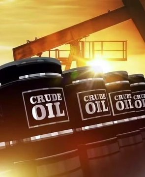 Black oil barrels labeled "CRUDE OIL" are stacked in front of a pump jack silhouetted against a golden sunset, symbolizing the image of petrole