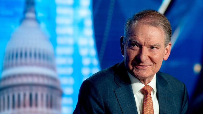 SEC Chair Paul Atkins, wearing a dark suit and red tie, is pictured with the U.S. Capitol dome illuminated in the background, visually reinforcing the post's message that the SEC is poised to move forward with regulatory action on digital assets regardless of legislative delays.
