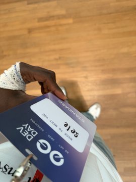 A close-up of a hand holding a GoodNotes subscription card showing '3 Years', '1 Year', and '3 Years' plan options on a blue background.
