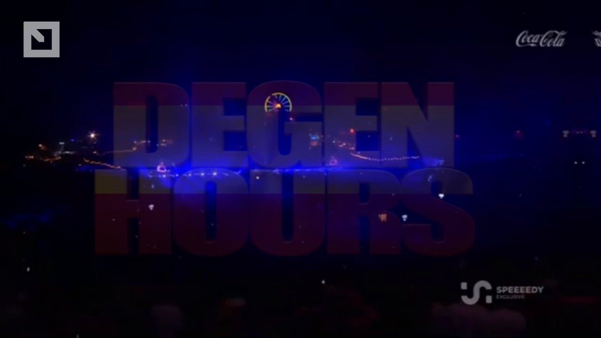 The image shows a large screen with the words "Degen Hours" written in red letters, along with an image of a Ferris wheel. The text also includes Spanish and English versions of the phrase. The background of the image features a dark blue sky with white lights, possibly representing a nighttime event or festival.