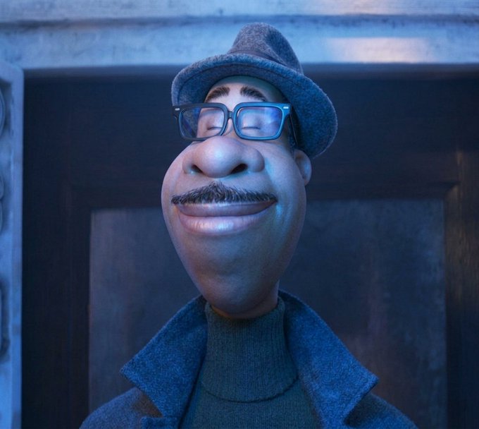 A 3D-rendered cartoon character of a man with glasses, a mustache, and a gray fedora smiles against a blue-lit wooden background.