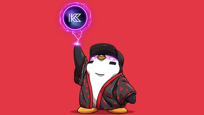 A digital illustration features a cute penguin mascot wearing a black cap and a red-and-black robe, casting a purple magical energy ball containing a stylized "K" logo above its hand against a solid red background.