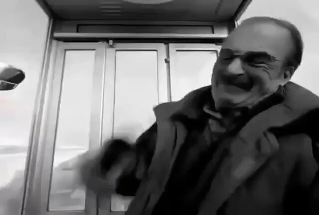 The image features a man wearing glasses smiling while he stands in front of an elevator door. The elevator appears to be closed as there's no visible movement or activity inside. In the accompanying text, it talks about a man selling shares online for $200K at 5% Cursors stake and how much they've become worth today. This interesting development may pique the interest of those who follow stock trading activities.