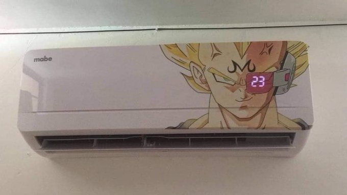 A Mabe brand air conditioner mounted on a wall, decorated with a large decal of Super Saiyan Majin Vegeta from Dragon Ball Z, with the digital display showing 23.