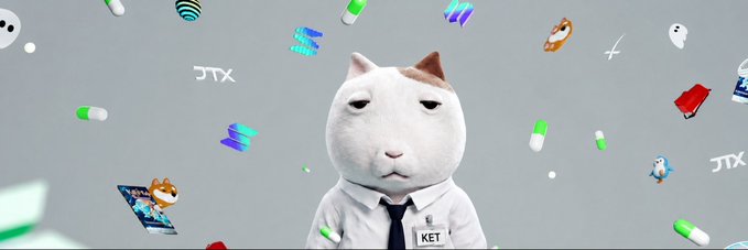 A serious-looking cat in a white shirt and tie, wearing a name tag reading "KET," stands stoically amid floating crypto symbols, pills, and "JTX" logos—visually capturing the chaotic and unpredictable "very interesting" crypto week ahead.