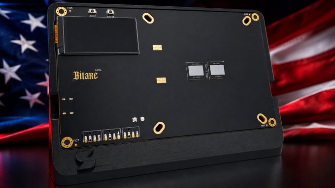 The back panel of a Bitaxe bitcoin mining device, displayed against an American flag backdrop, featuring circuit boards, ports, and gold-colored connector pads.