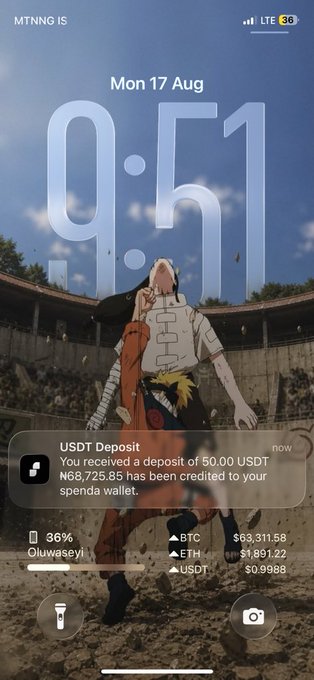 A phone lock screen displaying 9:51 on Mon 17 Aug with a USDT deposit notification crediting 50.00 USDT (₦68,725.85) to the user's spendr wallet, set against an anime wallpaper. The post's enthusiasm about not leaving the app is reflected by the crypto transaction alert and live BTC, ETH, and USDT prices shown on the screen.