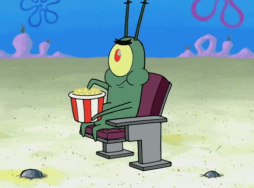 The image features a cartoon character, likely SpongeBob SquarePants, sitting in an empty chair with popcorn in his hand. The scene takes place outdoors, possibly at a beach or a park, as indicated by the presence of sand and grass visible in the background. The caption "$NEAR just flipped Sui" suggests that this image was taken during a recent event where SpongeBob SquarePants' character was involved in an activity related to the popcorn he is holding.