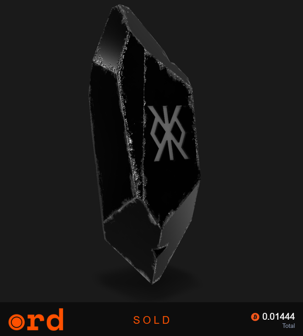 A black, crystalline ring or pendant with a geometric logo is displayed on a dark background, with 'ord' branding, 'SOLD' status, and a price of 0.01444.
