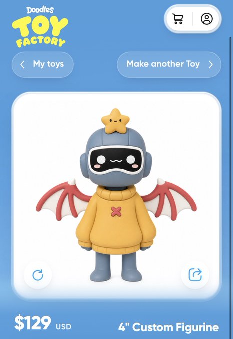 A screenshot of the 'Doodles Toy Factory' app showing a 3D figurine for $129 USD, featuring a character in a yellow hoodie with red bat wings and a star on its head.