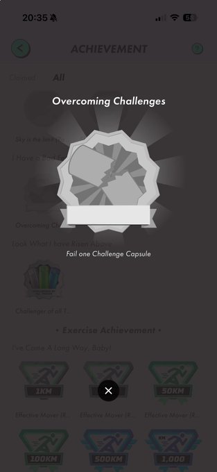 A mobile app screen titled 'ACHIEVEMENT' showing an 'Overcoming Challenges' badge for failing a Challenge Capsule, with exercise achievement tiers (1KM, 50KM, 100KM, 500KM, 1,000) visible below.