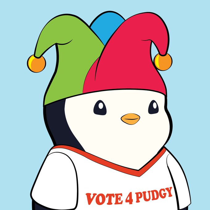 A cartoon penguin wearing a colorful jester hat with the text 'VOTE 4 PUDGY' on its shirt.