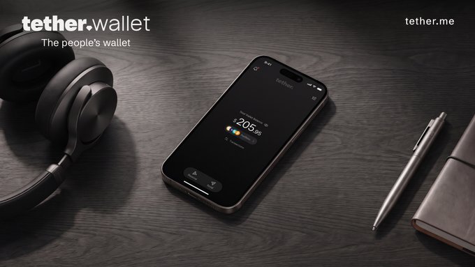A smartphone on a dark wooden desk displays the Tether Wallet app showing a balance of $205.96, flanked by black headphones, a silver pen, and a leather notebook, embodying the post's message of a clean, minimalist, and "delightful" design aesthetic.
