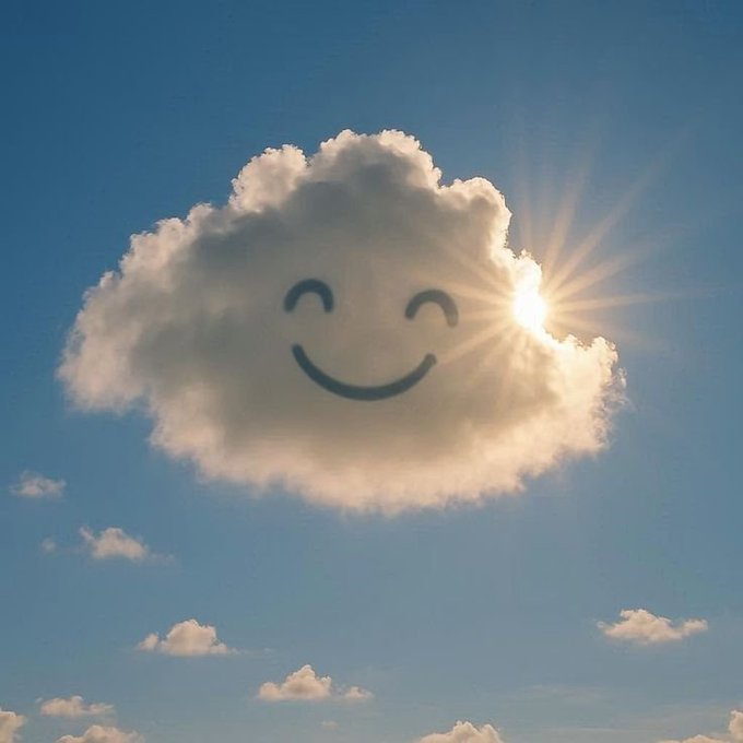 The image features a cloud that has been drawn into the shape of a smiley face, with the sun shining behind it. The caption for this image reads "Good afternoon ." and "Team funding remains solid and transparent. @0G_labs continues to attract strong investor backing for its AI infrastructure. @FIH_USD1 focus on efficient use of capital with community-driven growth rather than massive raises".