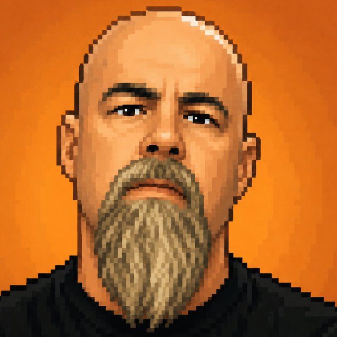 A pixelated portrait of a bald man with a long blonde and brown beard against an orange background.