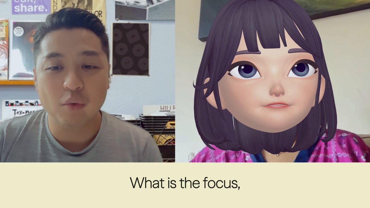 The image shows a man wearing a gray shirt sitting at a desk with a woman's face displayed on his computer screen. The focus of the image seems to be on the interaction between the two individuals, rather than the content of the image itself.