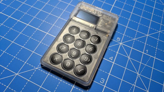 A "Coldcard" Bitcoin hardware wallet is shown, which has reportedly been compromised, leading to the theft of over $38 million in bitcoin.