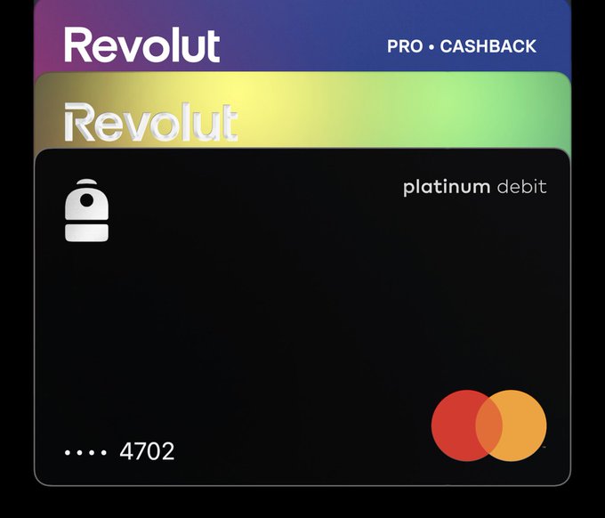 The image shows two Revolut cards stacked together - a gradient "Revolut Pro Cashback" card on top and a black "Revolut platinum debit" card ending in 4702 below, with the Mastercard logo visible. However, these cards do not match the post, which discusses the Backpack credit card—the image appears to be unrelated or a mismatched attachment to the caption.
