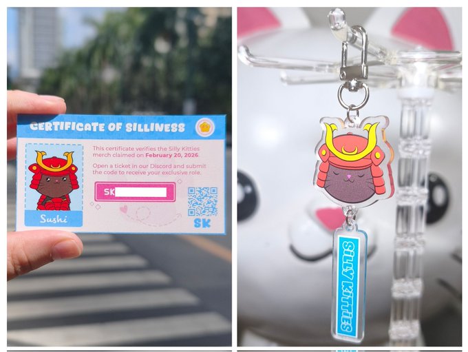 A hand holds a "Certificate of Silliness" from Silly Kitties claiming the merch on February 20, 2026, with a QR code and key, alongside a matching Silly Kitties acrylic cat keychain attached to a character charm. This relates to the Ronin February event, where attendees received codes with their keychains to claim an exclusive Discord role for a free Silly Kitties product.