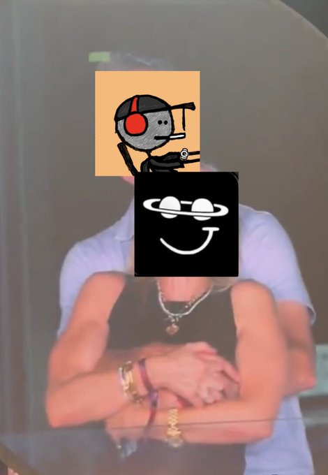 A person with their arms crossed wearing a white t-shirt, with two cartoon stickers (a gray figure with headphones and a grinning face with a planet ring) overlaid on their face.