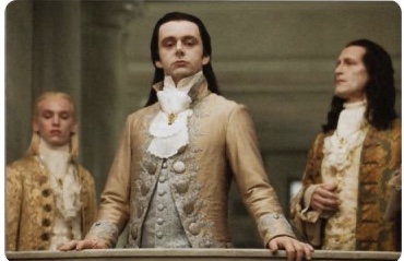 The image shows three men in ornate 18th-century aristocratic attire, with the central figure in a golden embroidered coat leaning on a railing in a grand setting, evoking a scene of nobility and old-world wealth. The caption connects to the post by satirically juxtaposing the image of aristocratic opulence with the poster's claim to invest only in "serious" tech like launchpads—suggesting their so-called sophisticated investments still carry the same speculative, performative vanity as chasing trendy memecoins.