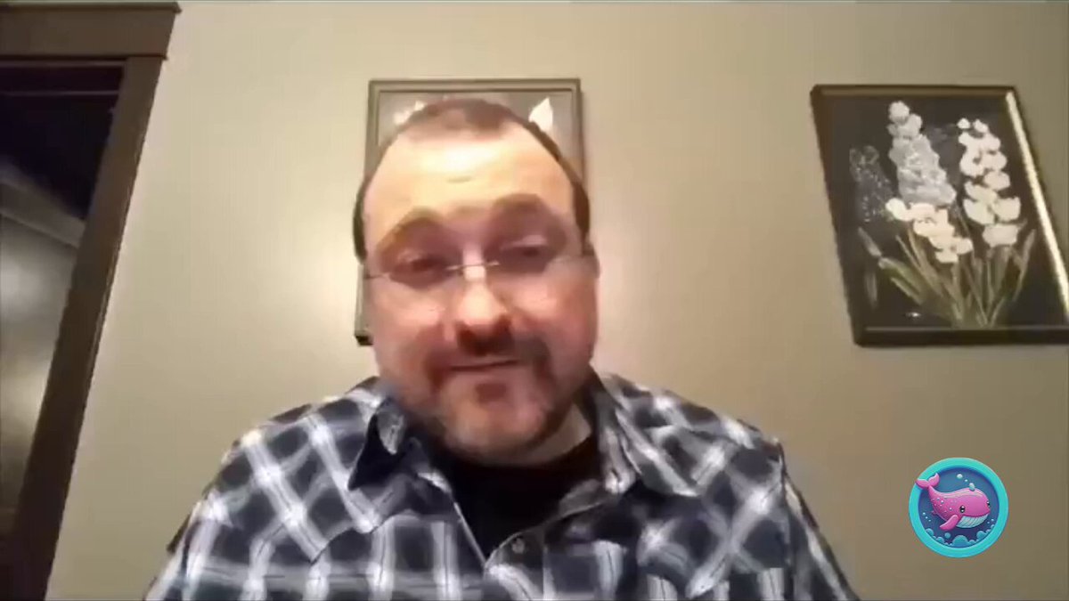 The image features a man wearing a blue plaid shirt, sitting at a desk with a computer screen behind him. He has glasses on his face, which suggests that he might be engaged in an online conversation or video call. The focus of this content is Charles Hoskinson's statement about the blockchain being the answer to all hacking and exploitation problems. 

The image contains no text, so it seems like a visual representation of the man's message rather than written content. The presence of the computer screen, along with Charles' statement, indicates that the discussion could be related to technology or digital security.