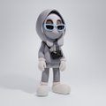 A small white and black figurine/toy of a hooded character standing against a plain white background.
