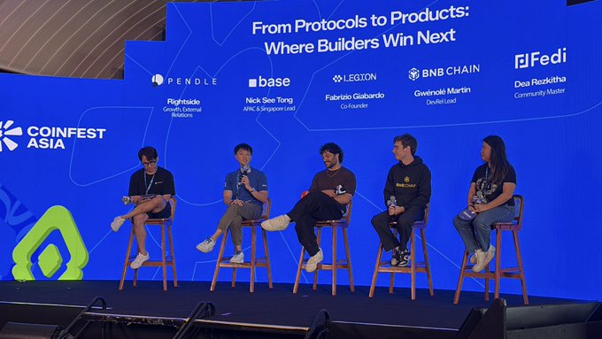 Five panelists sit on stools on a stage at 'Coinfest Asia' for a discussion titled 'From Protocols to Products: Where Builders Win Next,' featuring representatives from Pendle, Base, Legion, BNB Chain, and Fedi.