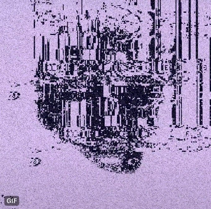 A heavily glitched, pixelated image on a lavender background, possibly an animated GIF as indicated by the watermark, creating a distorted, abstract face or form.