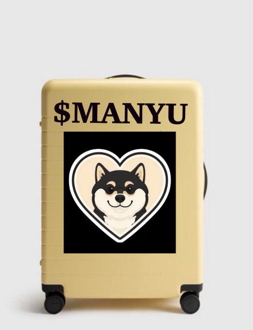 A cream-colored suitcase featuring '$MANYU' text and a heart-shaped logo containing a Shiba Inu dog illustration.