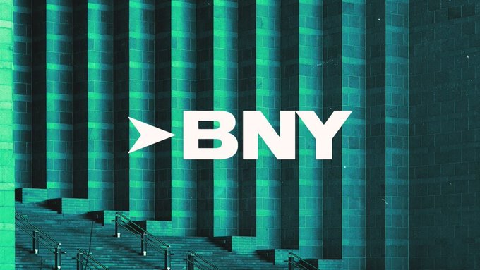 The BNY Mellon logo is displayed in white against a backdrop of teal-green architectural columns, visually representing the bank at the center of the post's news about its expansion into tokenization, RLUSD custody with Ripple, and plans for 24/7 settlement of tokenized U.S. Treasuries by 2027.
