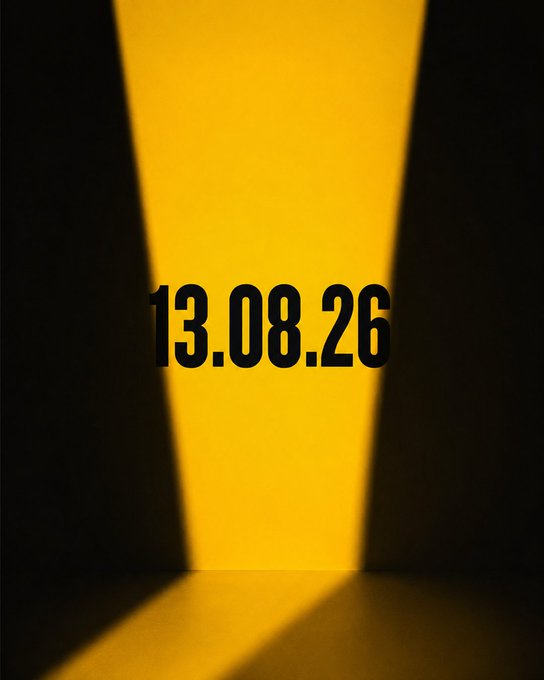 A minimalist digital graphic showing the date "13.08.26" in black text against a yellow illuminated background between dark walls.