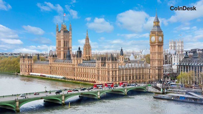 The image shows the Palace of Westminster, Big Ben, and Westminster Bridge in London with the "CoinDesk" watermark, visually representing the UK government and banking sector at the center of the parliamentary scrutiny over crypto firms' banking access.
