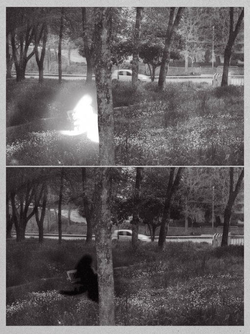 A black and white double-exposed photograph showing a park scene with trees, where a ghostly figure appears to be sitting on the grass in both frames.