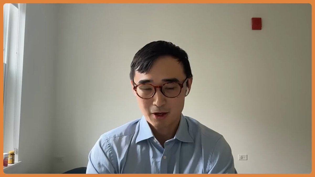 The image shows a man wearing glasses sitting at a desk with his eyes closed while looking down at the camera. The background of the image features a white wall, which contrasts with the orange border around the frame. There are also two bottles visible on the left side of the image. The text in the image reads: "USDC is the second largest stablecoin by market cap @circle Chief Economist and Head of Research @gordonliao explains why USDC has such an advantage for institutional adoption, and how machine-to-machine protocol is something to keep an eye on."